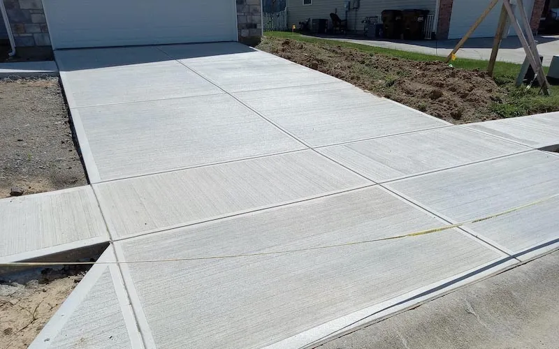 Fresh newly poured concrete driveway.